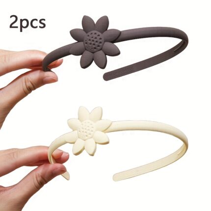 Two matte daisy flower decorated thin plastic headbands in dark brown and cream beige for daily hair styling