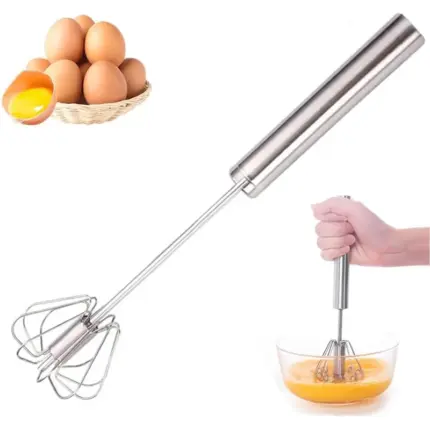 Stainless steel semi-automatic rotary egg whisk, handheld manual mixer used for beating eggs in glass bowl with raw eggs as baking kitchen accessory
